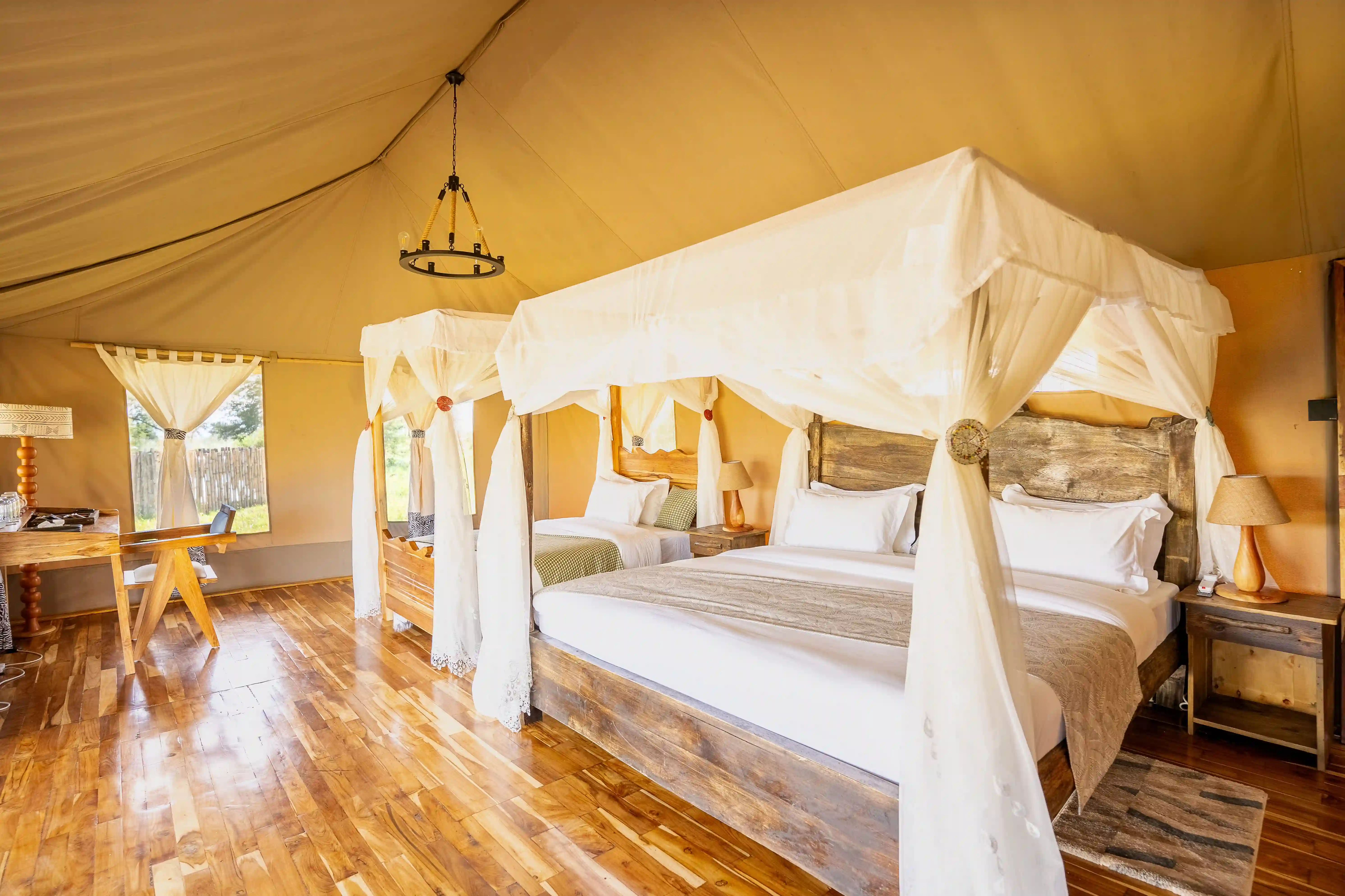 Elegant tent interior with four-poster canopy bed